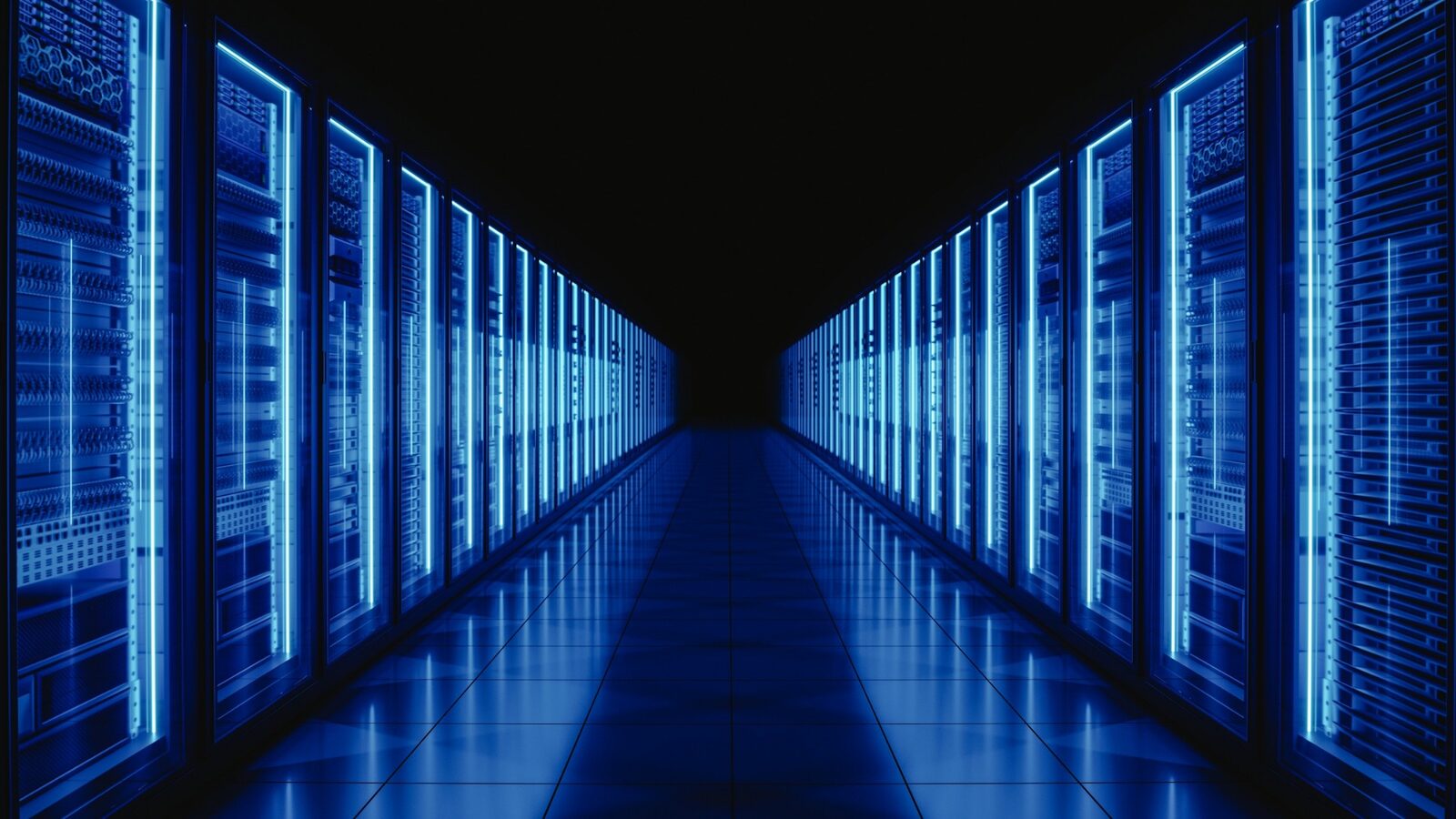 Data centre corridor with illuminated server racks in blue light — technology infrastructure at scale.